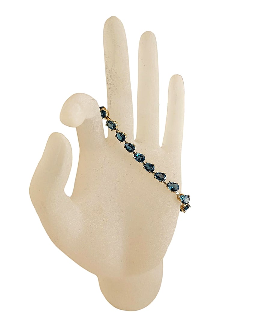 10K Yellow Gold - London Blue Topaz Bracelet. 7 - 8".: Pear cut London Blue Topaz with good color.
