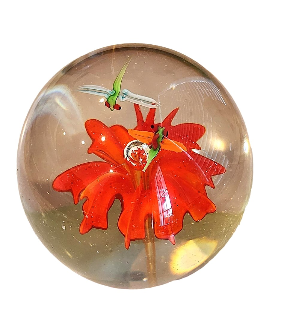 Glass Paperweight Featuring Dragonflies and Center Red Flower. 3 1/2" wide x 3 1/4" tall: 2 dragonflies hoovering over a lare red flower.