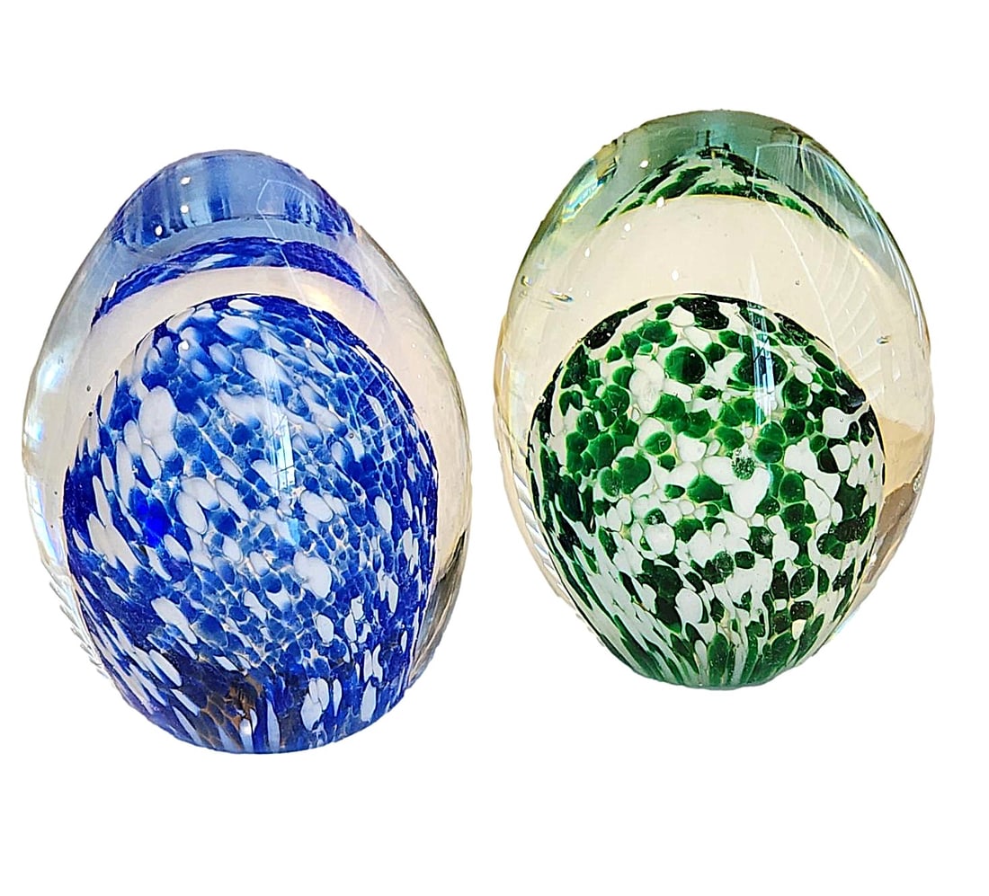 2 Glass Paperweights - one Green and White and one Blue and White Center Features. Unmarked.: Blue - 3" x 2" and Green 3" x 2 1/2". Egg-shape.