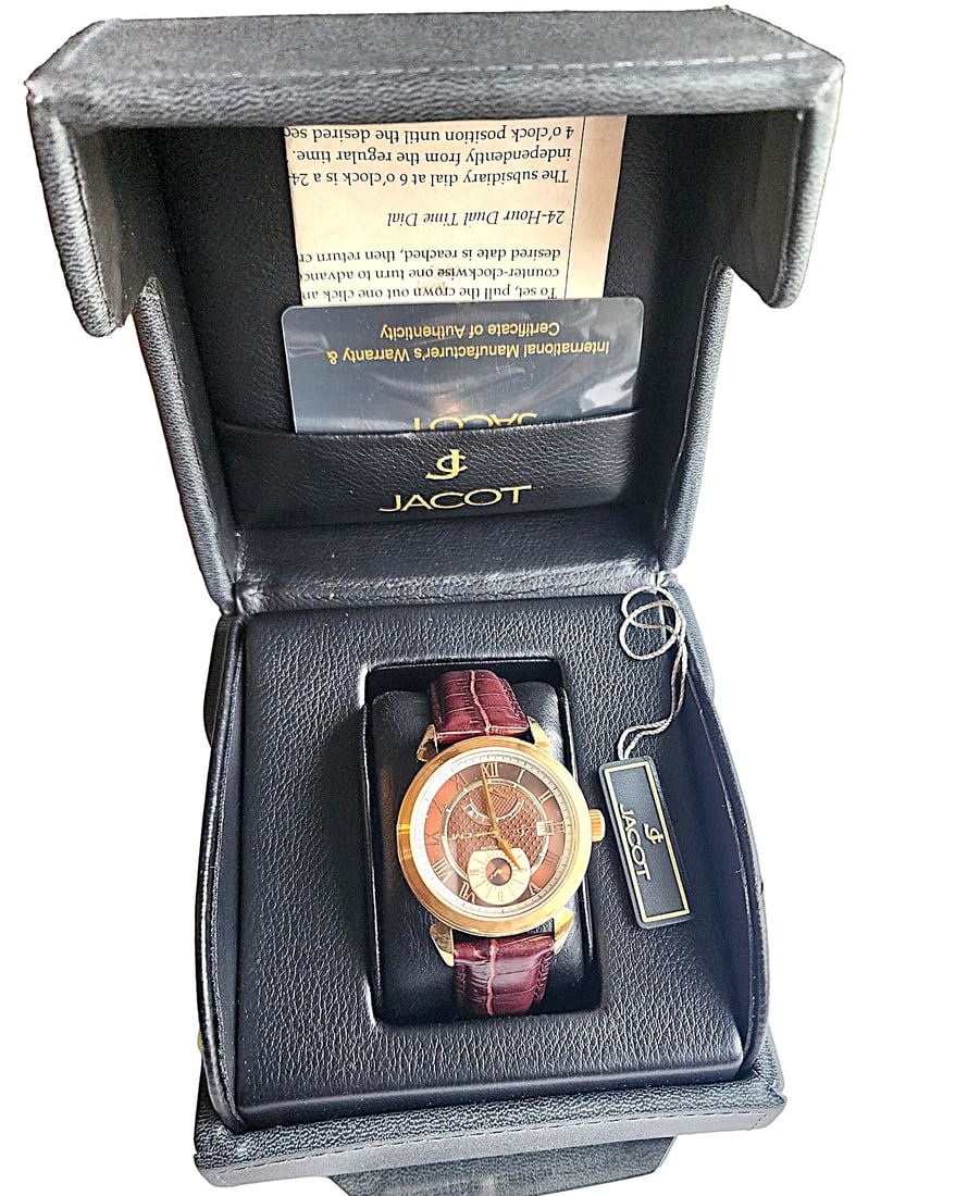 Vintage Jacot Skeleton Perpetual Motion Wristwatch - New in box.: Beautiful Rose Gold plated watch casing with genuine brown leather band. This watch features a round case with brown face and rose gold hands and facial features. This watch is all stainless steel. Wa