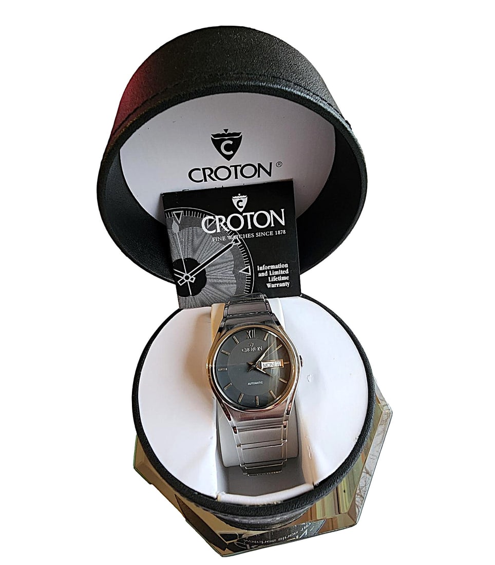 Vintage Croton Perpetual Motion Movement Men's Wristwatch - New: This watch is exquisite. All Stainless Steel. Very Sleek design. Automatic perpetual motion works. Stainless steel casing. Sapphire Crystal. 3ATM / 65 ft Water Resistant. This watch is Vintage and any