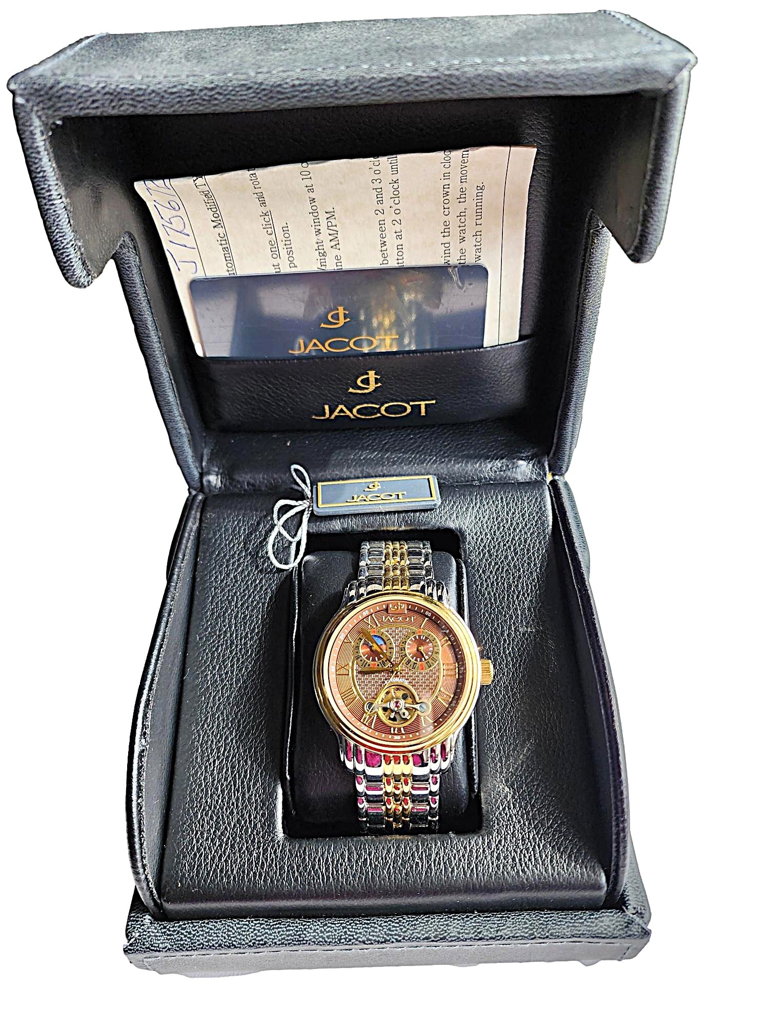 Vintage Jacot Men's Skeleton Works Wristwatch - New in Box: This Jacot wristwatch is new. It is elegant. The watch case features a round watch face in brown. Gold plating on Stainless Steel case and band. The watch is in excellent condition, automatic movement