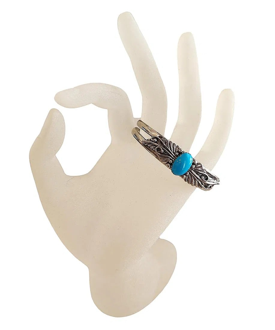 New - Sterling Silver Small Cuff Bracelet featuring a Turquoise Cabochon Stone Center: This thin cuff bracelet is brand new. The sterling silver features feather design on each side the center Turquoise stone. Stamped 925. The metal is flexible for adjusting fit.