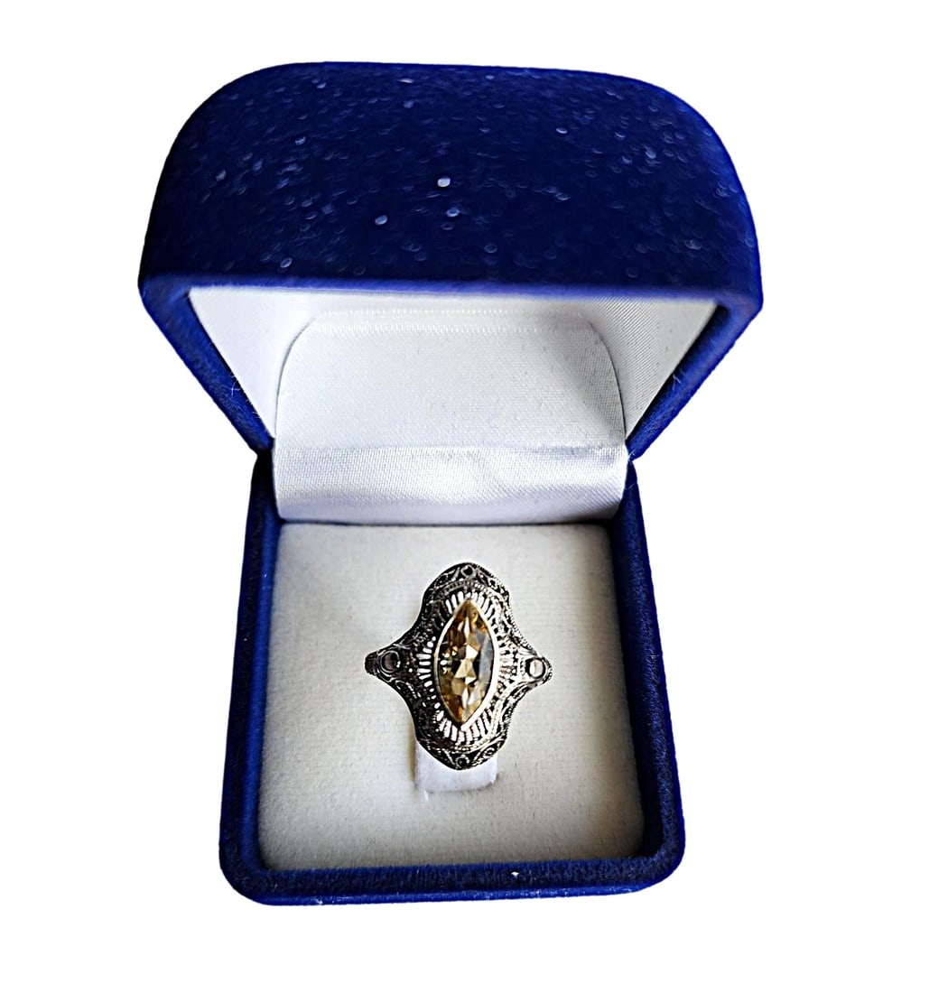 Vintage Sterling Silver Filagree Setting with Marquis Cut Genuine Citrine. Size - 7: The setting for this ring is quite elaborate. It is very delicate and detailed. In the center sits a large Marquis Cut Genuine Citrine. Nicely cut and clear stone. Ring is Size 7, but can be sized. Es