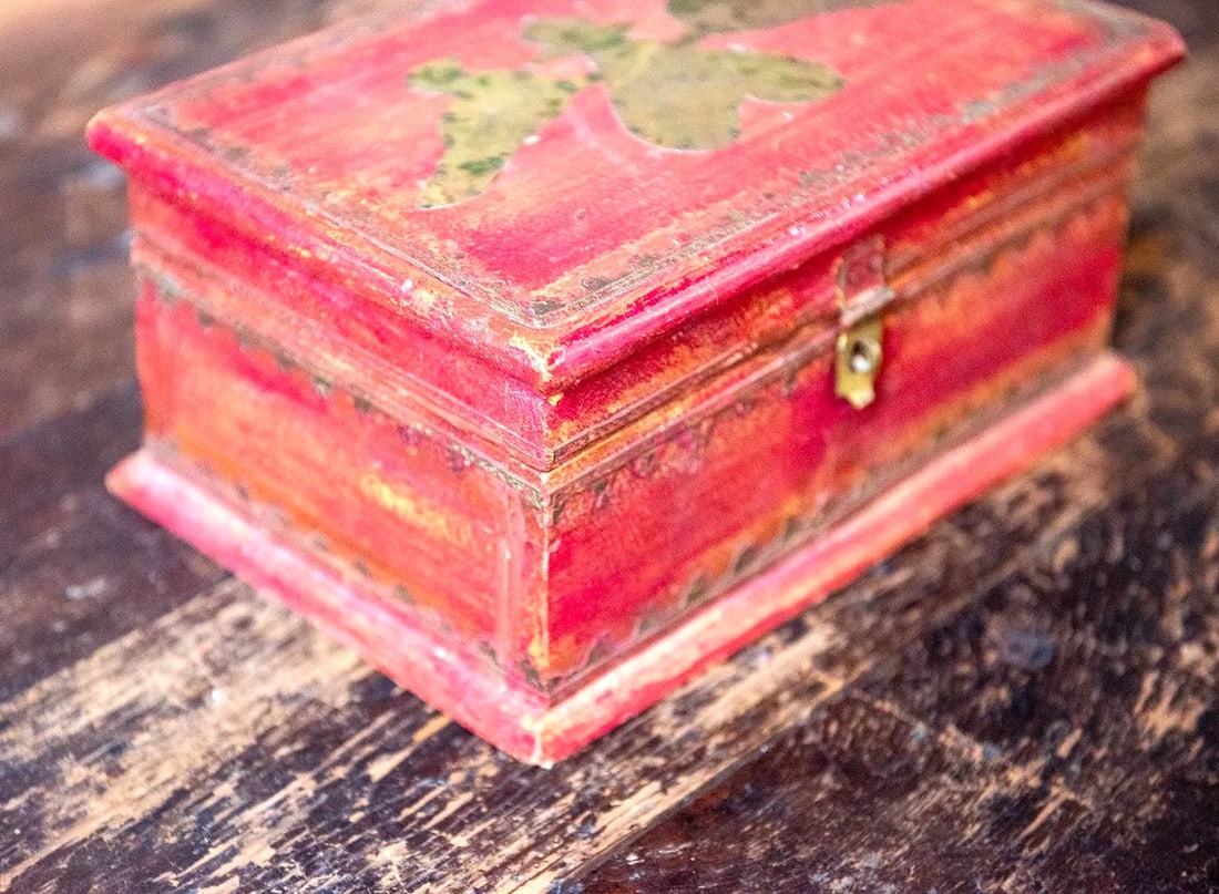 Antique Wooden Box - Red with Decorative Tin Design.: Distressed red stained wooden box with tin accents on the trim and top. Appears to be handmade. Maker unknown.