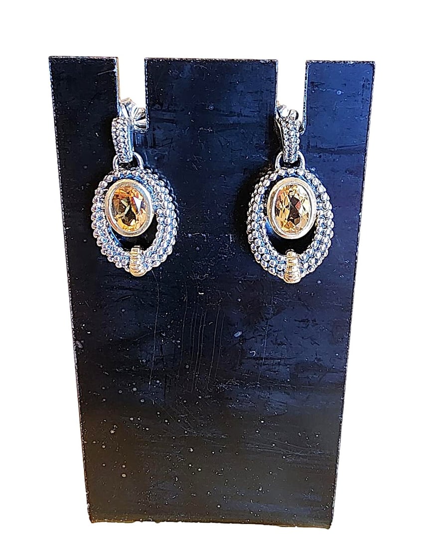 Genuine Citrine Drop Earrings set in Sterling Silver and Gold: New. Very nice Citrine stones set in a a drop setting with Gold knob work on Sterling silver metal. Pierced earrings.