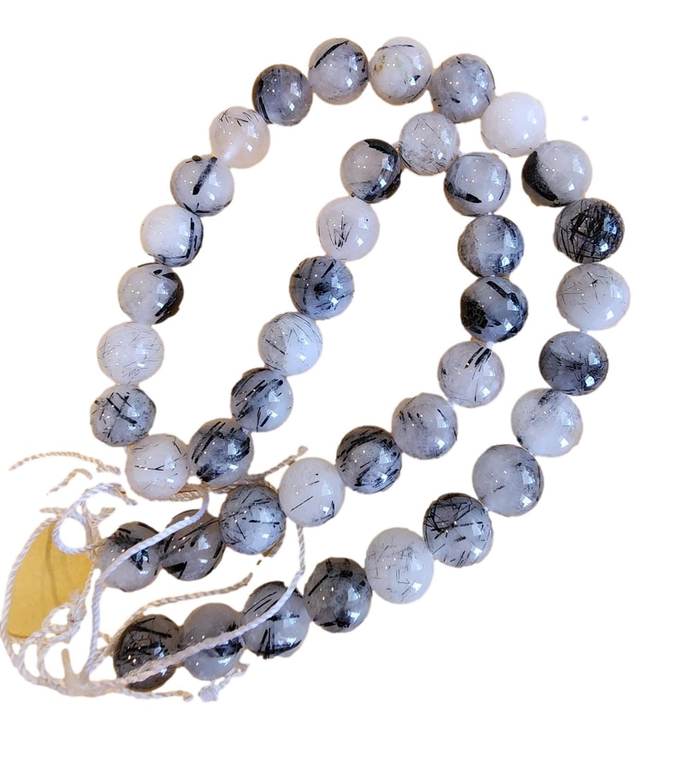 41 Strand of Tourmalinated Quartz Beads - 10MM Polished Round Beads: New. These beads have center drilled holes. Ready for your custom jewelry piece. Tourmalated quartz (or tourmalinated quartz) is a natural variety of clear or milky quartz characterized by striking, n