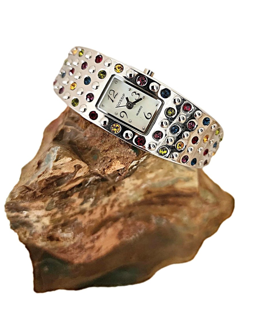 Vintage Cuff Watch by Gossip Featuring Multi-colored Stones - Running: This watch is exquisite. It is by Gossip. It features various colored stones throughout set in a silver-tone metal.