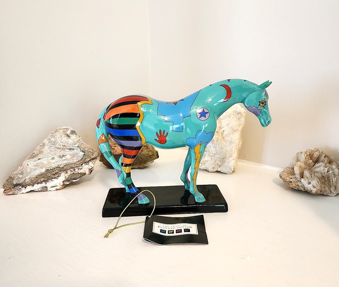 Trail Of Painted Ponies - Spirit War Pony - #1462: New in Box. From a Private Collection. This figurine features a Turquoise Horse with Native American war paint throughout the figure. Numbered IE/6929. Measures: 7 1/2 x 6 1/2 x 2 3/4.
