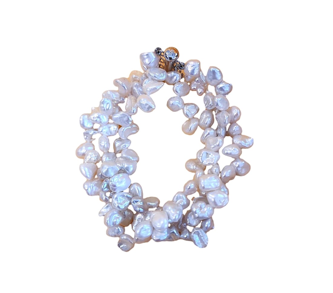 Freshwater Keshi White Cultured 3 Strand Pearl Bracelet: New - Keshi Cultured Pearls. Keshi pearls are unique, non-nucleated pearls formed as beautiful, accidental byproducts of pearl cultivation. Because they are composed of \(100\%\) pure nacre rather