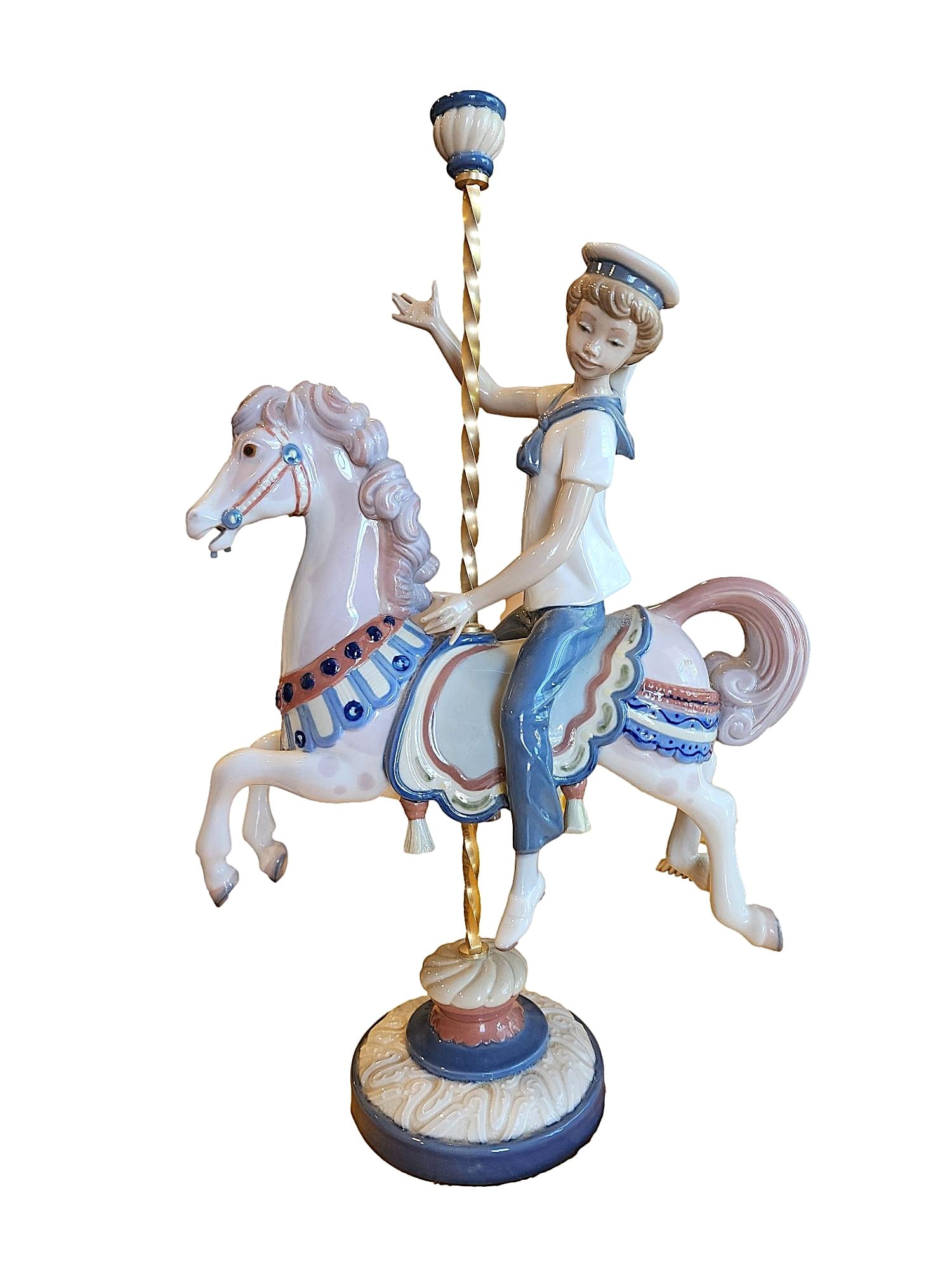 Vintage Lladro "Boy on Carousel Horse" #1470 - Retired: This sculpture is retired. Issued 1985. Sculpted by Jose Puche' Retired - 2000. Measures: 15" x 9" x 5". This figurine is missing the flower cap on the top of the pole.Product Name: Lladró Boy on Car