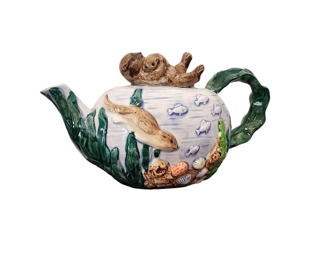 Vintage Takahashi San Francisco - Handpainted Otter and Baby Teapot: The Takahashi San Francisco otter and baby teapot is a highly collectible vintage ceramic piece hand-painted in Japan. It features a whimsical, three-dimensional or raised design of an otter swimming 