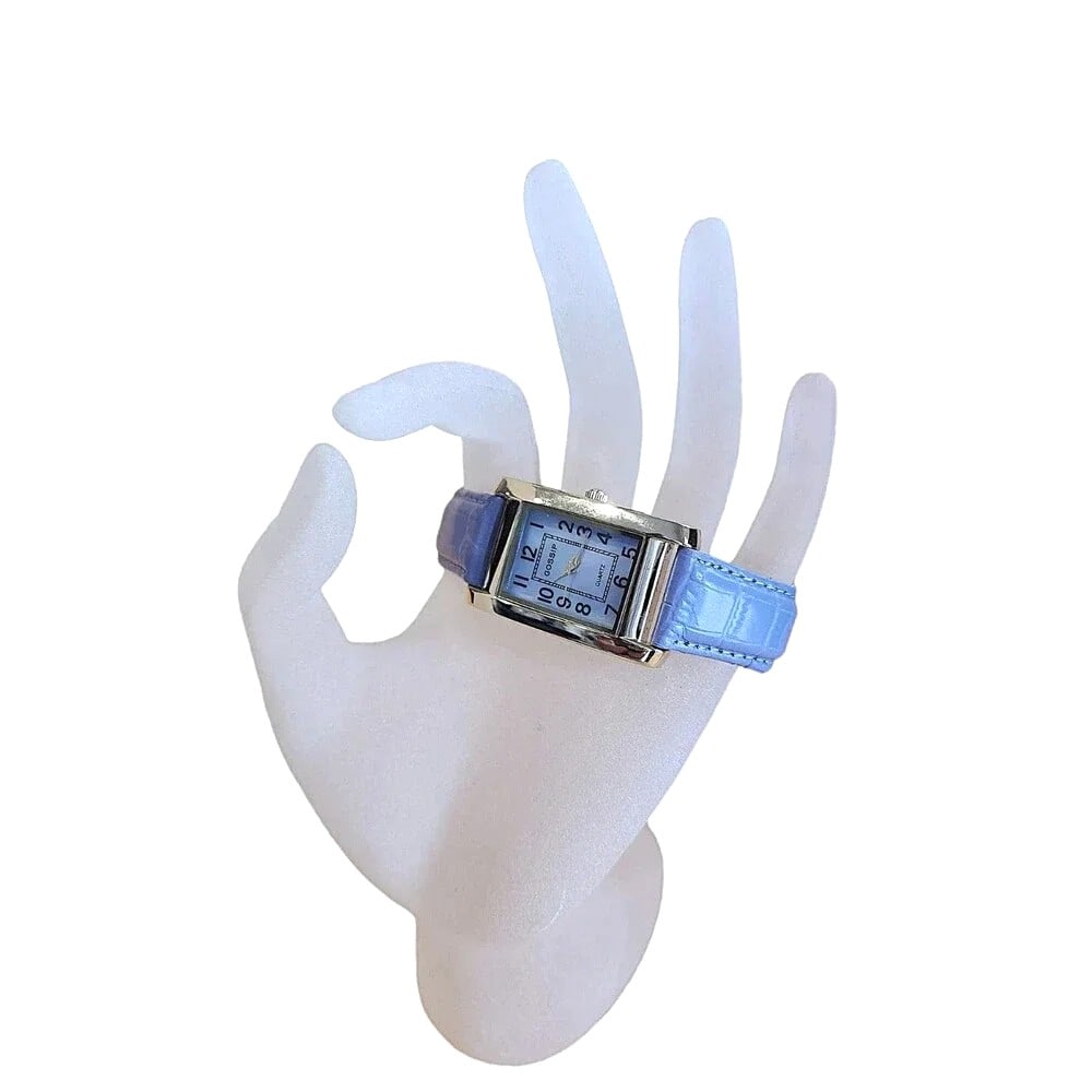 New Gossip Quartz Watch with Lavender w/ Pearlized Face - Leather Strap: New - Stainless Steel Casing. GSP231A - 187 - PC21. Japanese Movement. Lavender Leather Strap. Comes with the original case. New Battery and snap back. Watch is running. The pearlized watch face is be