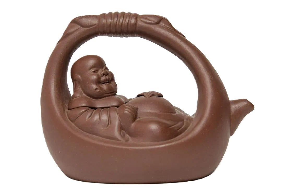 Chinese Yixing Pottery Teapot, Laughing Buddha: Brown Clay Chinese Yixing teapot, pottery in the form of Budai, or the Laughing Buddha, bearing seal stamps at base of handle. 6.5" H x 8.25" L x 5.5" W. In very good condition.
