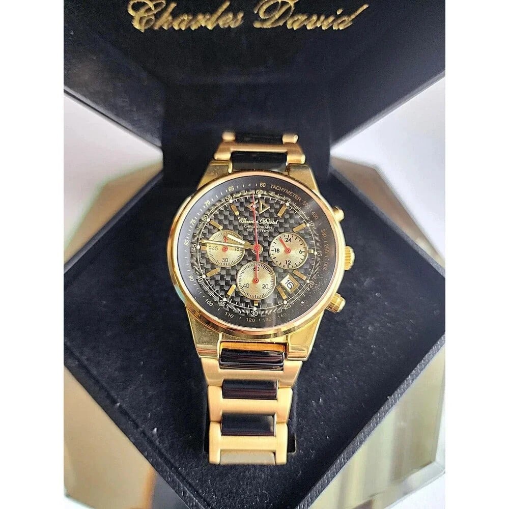 Vintage Charles David Men's Wristwatch Magma GSS Grand Prix Band- New: 71457 Men's Magma GSS Wristwatch w/ 18Kt Gold Plated Grand Prix Band #31723. Stainless Steel Case. Water Resistant 100 Meters Sapphire Crystal. Chronographic 1/1 Sec Basis. Due to the age of this watc