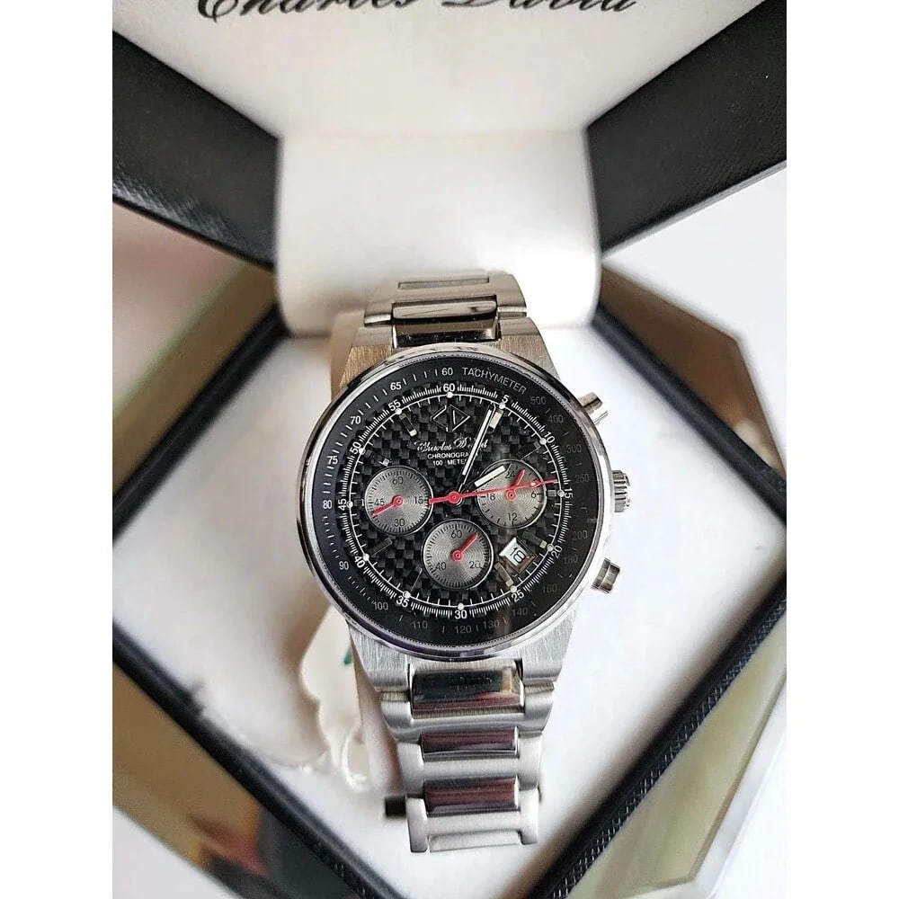 Vintage Charles David Men's Magma SS Wristwatch w/ Stainless Steel band.: Valued at $325 - $425. I bought out a watch store many years ago. We are listing all of our collection. This watch has a new battery. This watch is Water Resistant to 100M. Sapphire Crystal - Chronogr