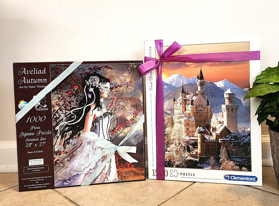 Castles and Kings - 2 Puzzles featuring a Historic Castle and Edwardian Lady: This lot features 2 puzzles - one of the Historic Castle Neuschwanstein and a Lady dressed in historic attire with a costume mask - Aveliad Autumn by Nene Thomas. The castle puzzle has 1500 pieces and