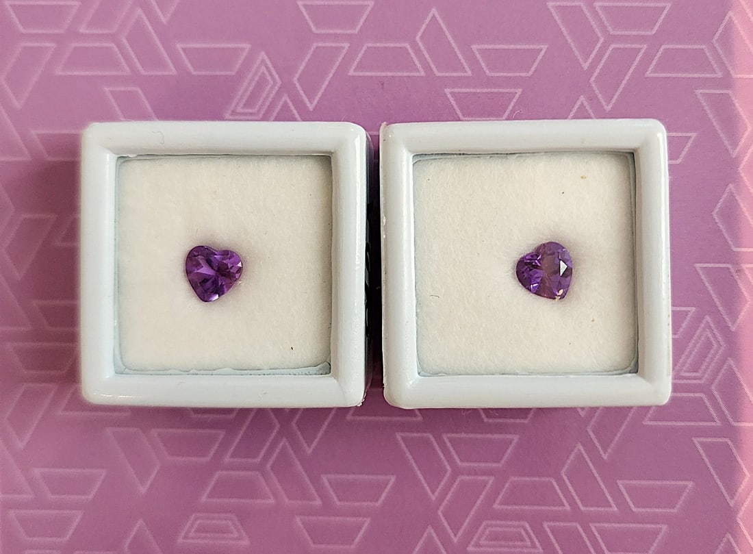 2 x Amethyst Heart Cut Gemstones - 3/4ct - from Brazil: Nicely cut and colored - 2 heart shaped Brazilian Amethyst gemstones. 3/4ct. Deep purple amethyst is a powerful spiritual stone known for enhancing intuition, promoting deep meditative states, and pro