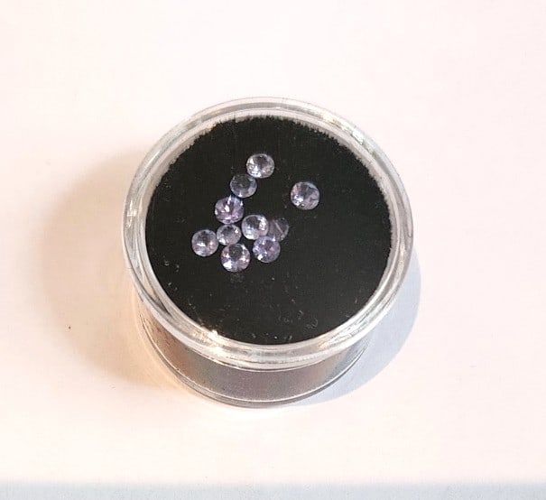 10 Pieces - Round Cut Tanzanite Gemstones - Light Purple: These stones measure 2.5 - 3.25mm. Nicely cut and color. Lot of 12 stones.