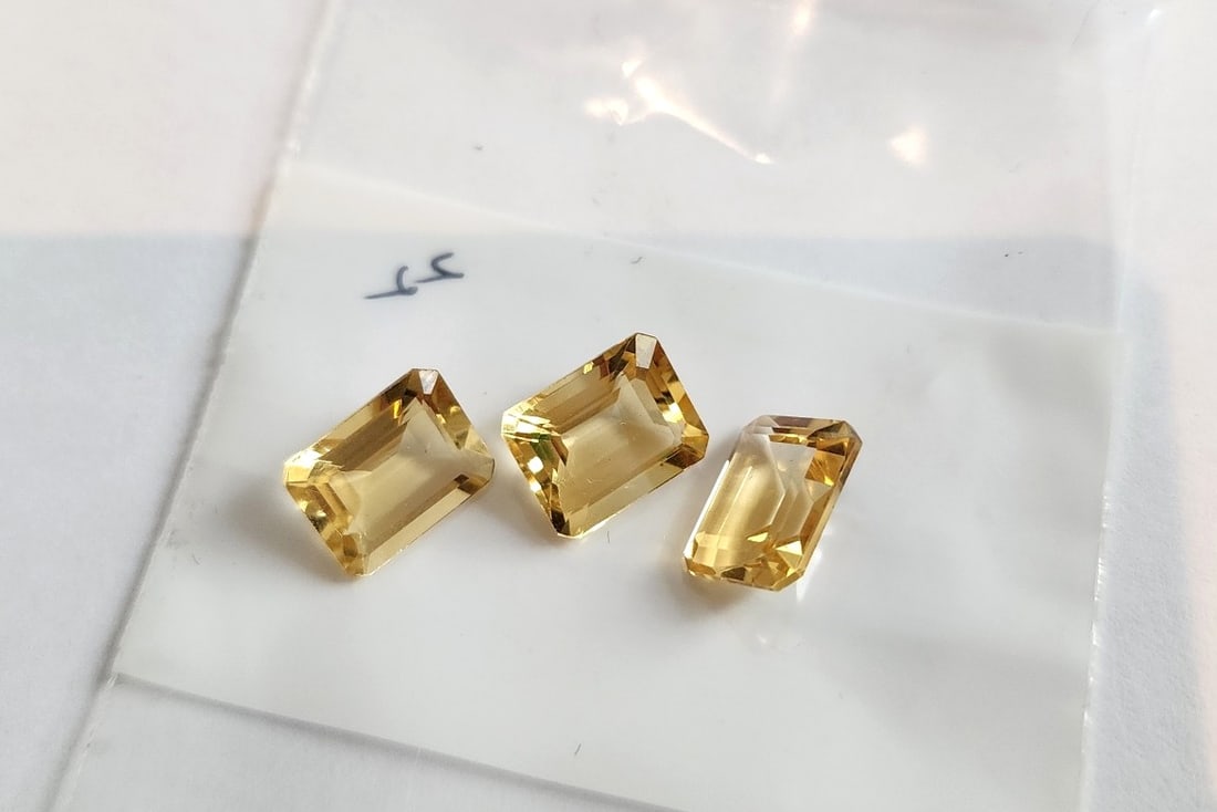 3 Emerald Cut Citrine Gemstones: Nice Cut and Color. Matching in size. Clean and clear. I do not have carat weight for this lot.
