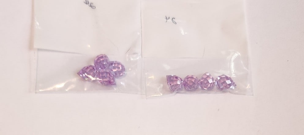 8 Briolette Amethyst - pre-drilled. Matching set.: Nicely Cut and color. These gemstones are pre-drilled. They are ready for your necklace or earring jewelry making project. By Mueller and Yammine, Inc.