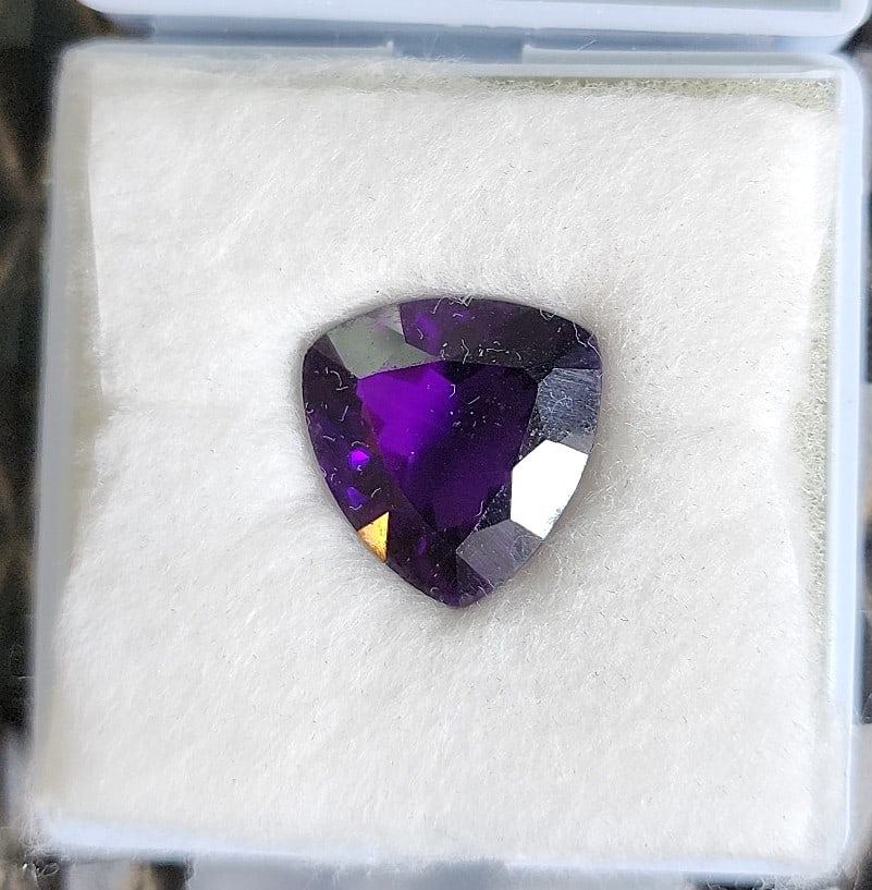 18.3 ct. Noble Trillion Purple Amethyst Gemstone: Looking for that Pendant Center stone? This is really nice! The trillion cut makes it unique and it has a deep purple color with bits of deep pink showing.