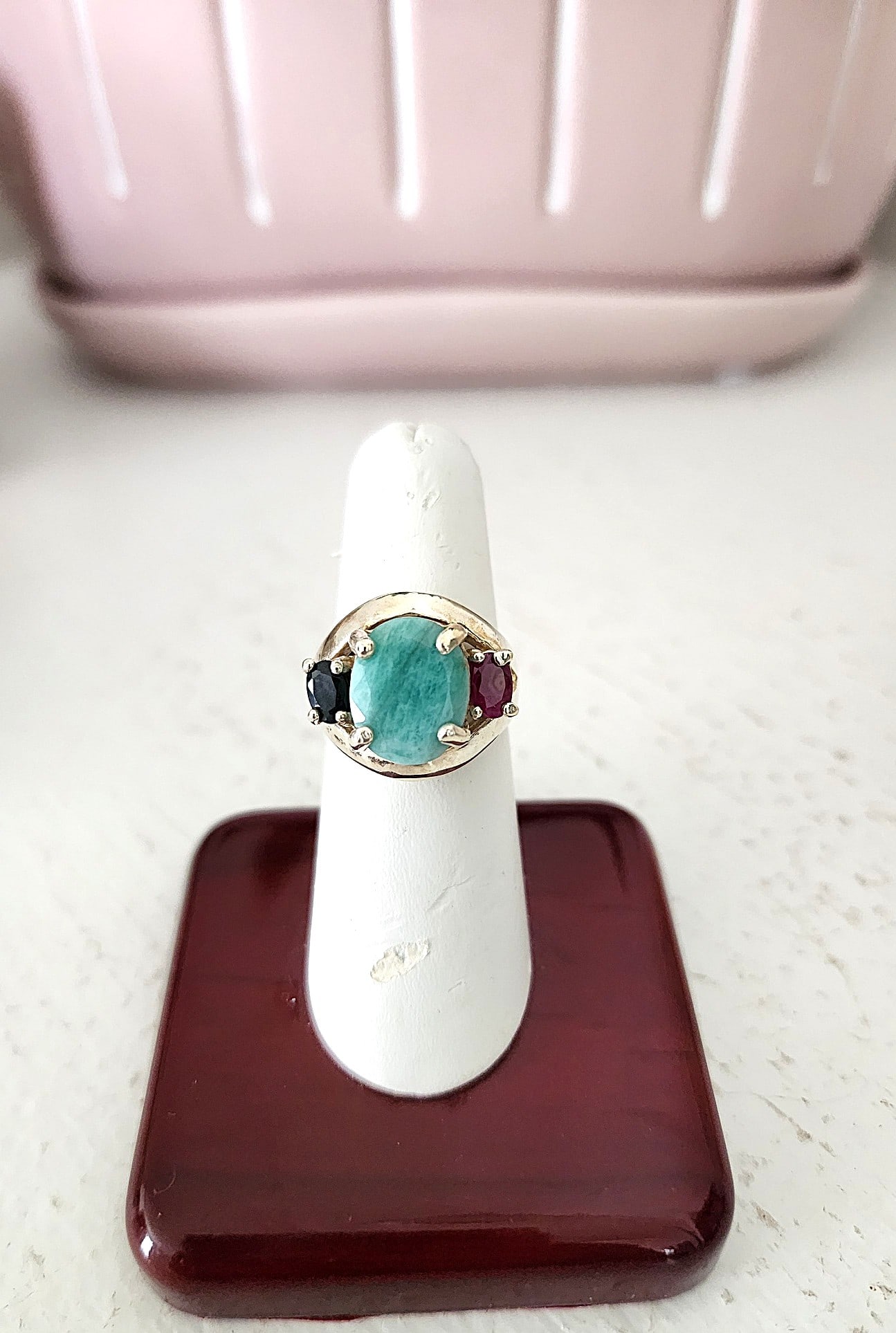 Sterling Silver Ring with Green Beryl, Ruby, and Sapphire Stones. Size 8 1/4: This ring is old. The center stone is a Green Beryl and is a nice color overall. The red stone on the side is a ruby (I do not have carat weights for the stones) and the opposite stone is a sapphire. 