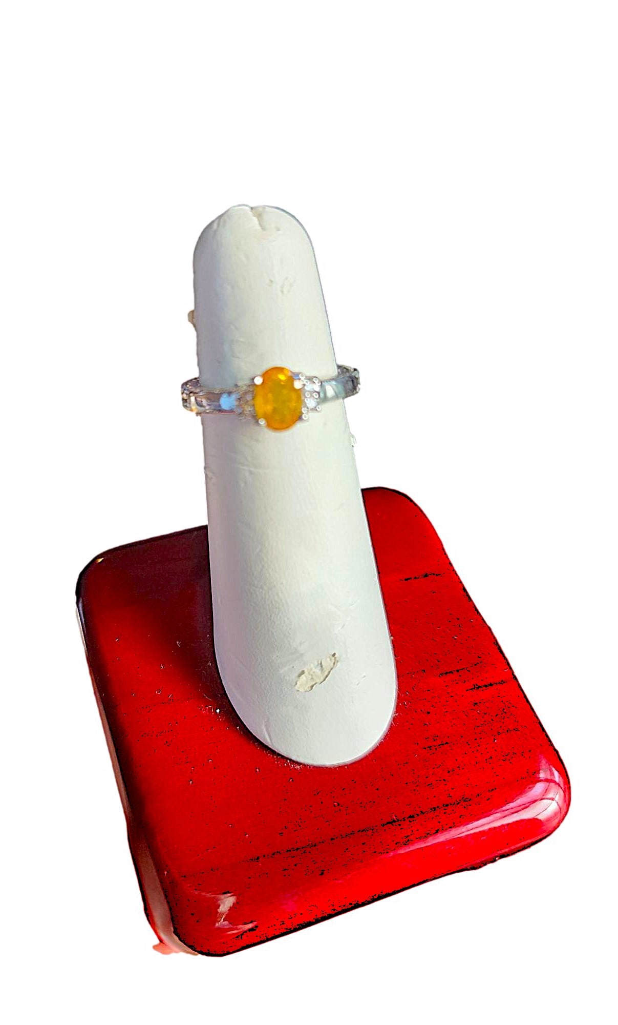 .96 Oval Cut Gold Yellow Sapphire in Sterling Silver Ring - Size 6 1/4: Pretty stone set in a sterling silver ring setting. the Main stone is flanked by 2 CZ stone on each side. The silver is heavily stamped and decorated with geometric pattern.