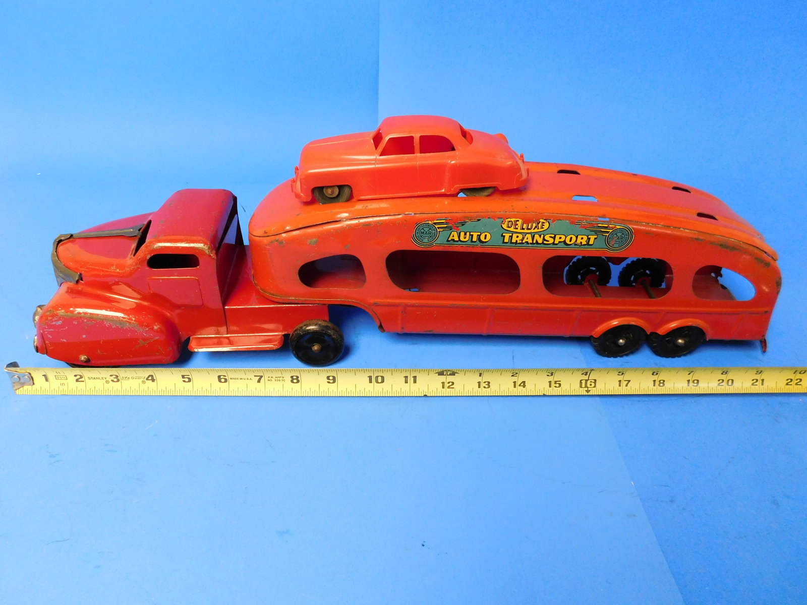 Marx Deluse Auto Transport Pressed steel Car Carrier with One Car RED: Marx Auto Transport Truck and Cab has one Car Color is RED. Displays nicley