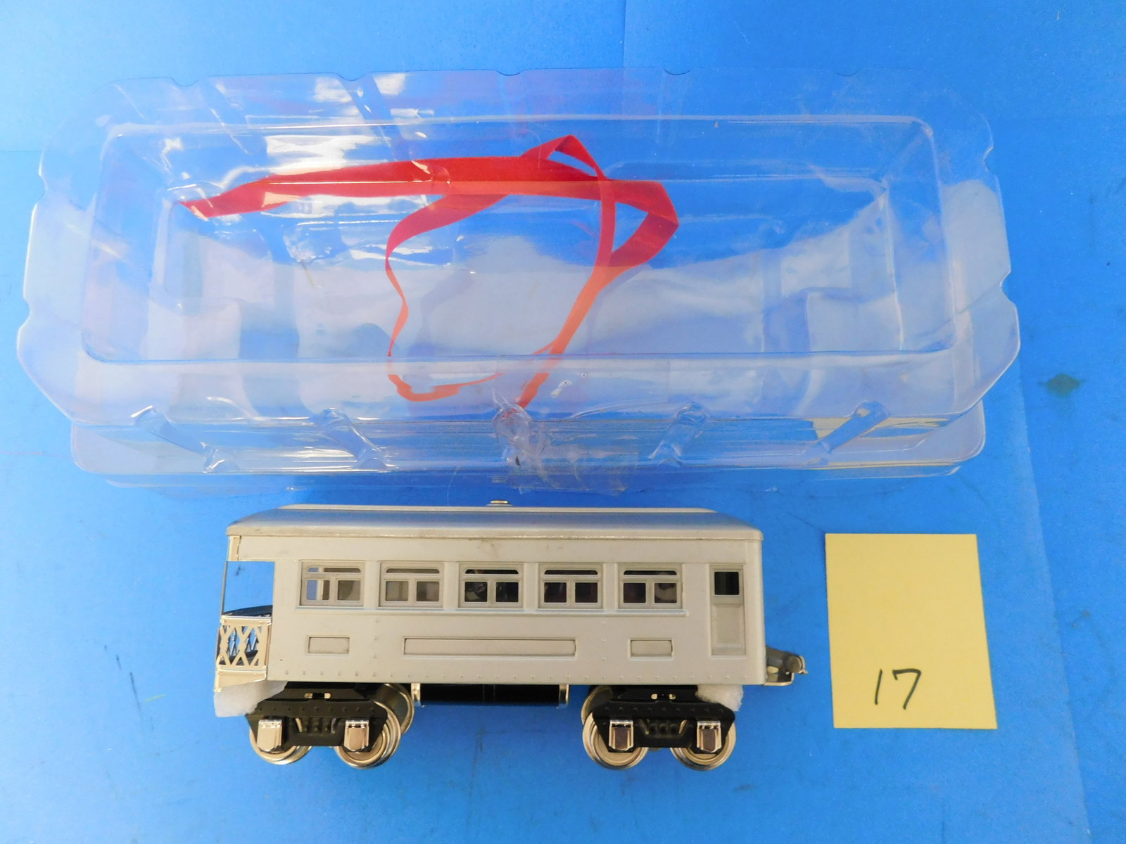 MTH O gauge Timplate 604 Brass and Nickel Unpainted Observation Car: MTH #604 Unpainted production sample Tin Passenger car in the basic inner wrapping without a box. Has nickel trim and brass vestibule