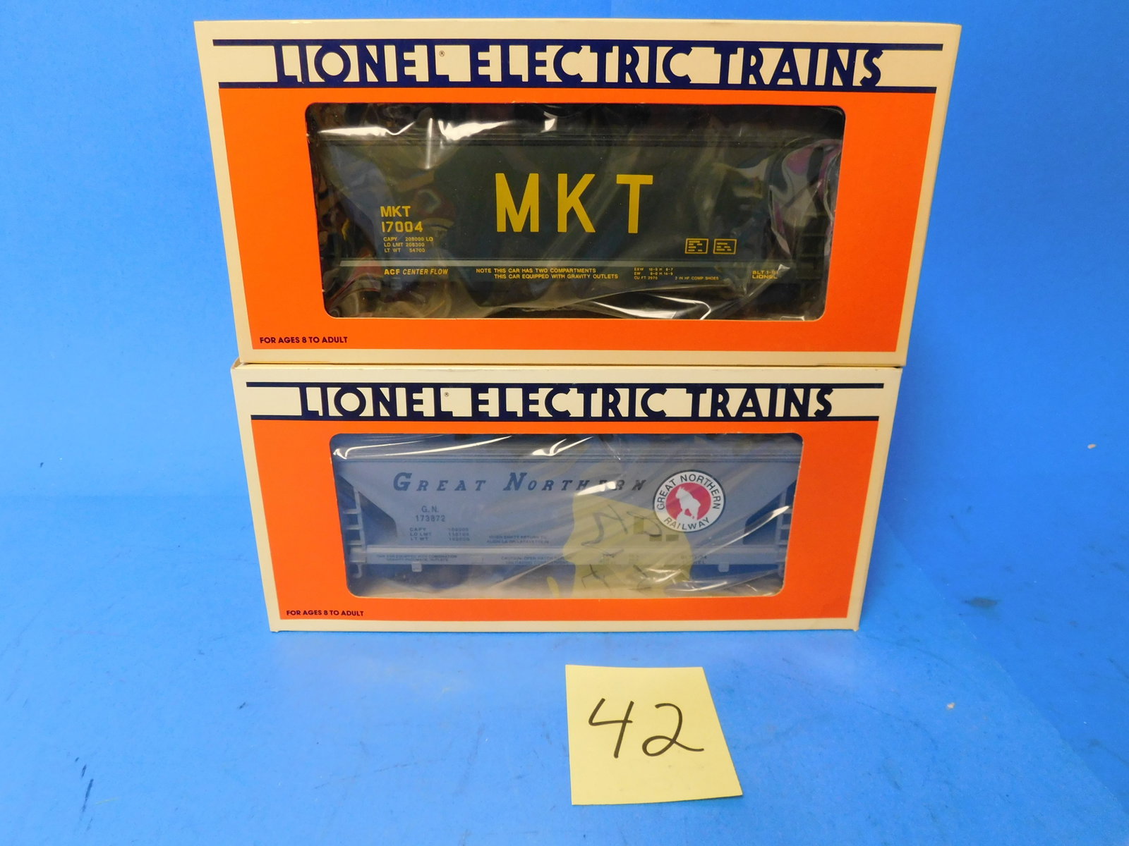 Lionel LLC Rolling Stock Hopper 2 bay and center Flow. MKT GN: Two Hoppers. MKT and Great Northern. 6-17004 and 6-17007