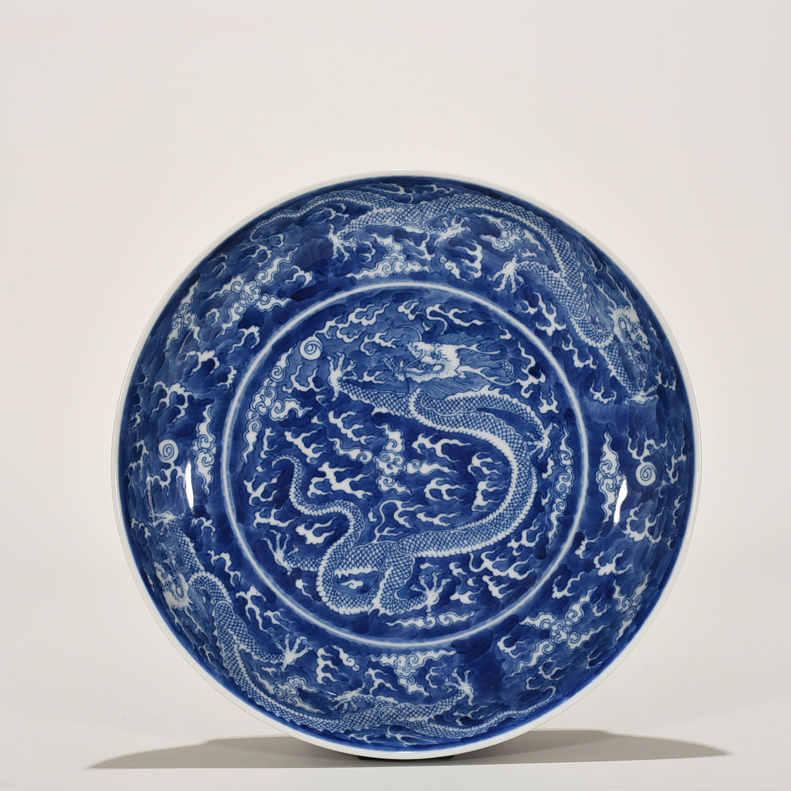 Qing Dynasty Kangxi blue and white dragon porcelain plate: Size: Width 24 cm - Height 5 cm Materials: Porcelain Time Period: Qing dynasty Manufactured Date: Kangxi Mark & Period Object: Chinese Antique ⛨ Purchase With Confidence ✔ Verified
