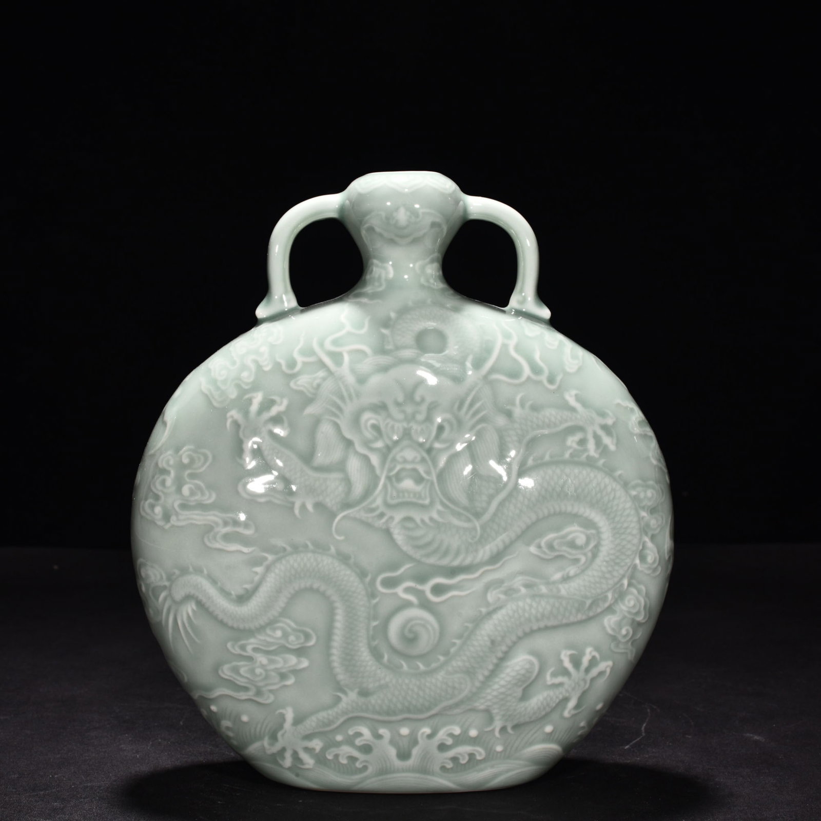 Qing Dynasty Qianlong pink celadon glaze carved cloud and dragon flat bottle: Size: Height 22 cm - Width 18 cm Materials: Porcelain Time Period: Qing dynasty Manufactured Date: Qianlong Mark & Period Object: Chinese Antique ⛨ Purchase With Confidence ✔ Verifi