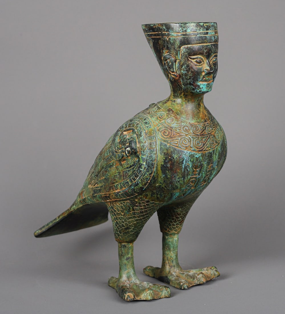 Han Dynasty Bronze human-faced bird Zun: Size: Height 25 cm - Width 25 cm Materials: Bronze Time Period: Han dynasty Manufactured Date: 1st Century Period Object: Chinese Antique ⛨ Purchase With Confidence ✔ Verified Auction