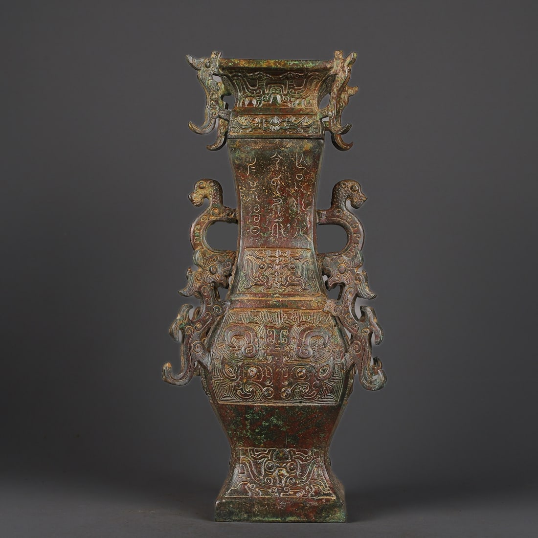 Zhou Dynasty Bronze square bottle with four dragon inscriptions: Size: Height 33 cm - Width 16 cm Materials: Bronze Time Period: Zhou dynasty Manufactured Date: 1050-BC Period Object: Chinese Antique ⛨ Purchase With Confidence ✔ Verified Auction