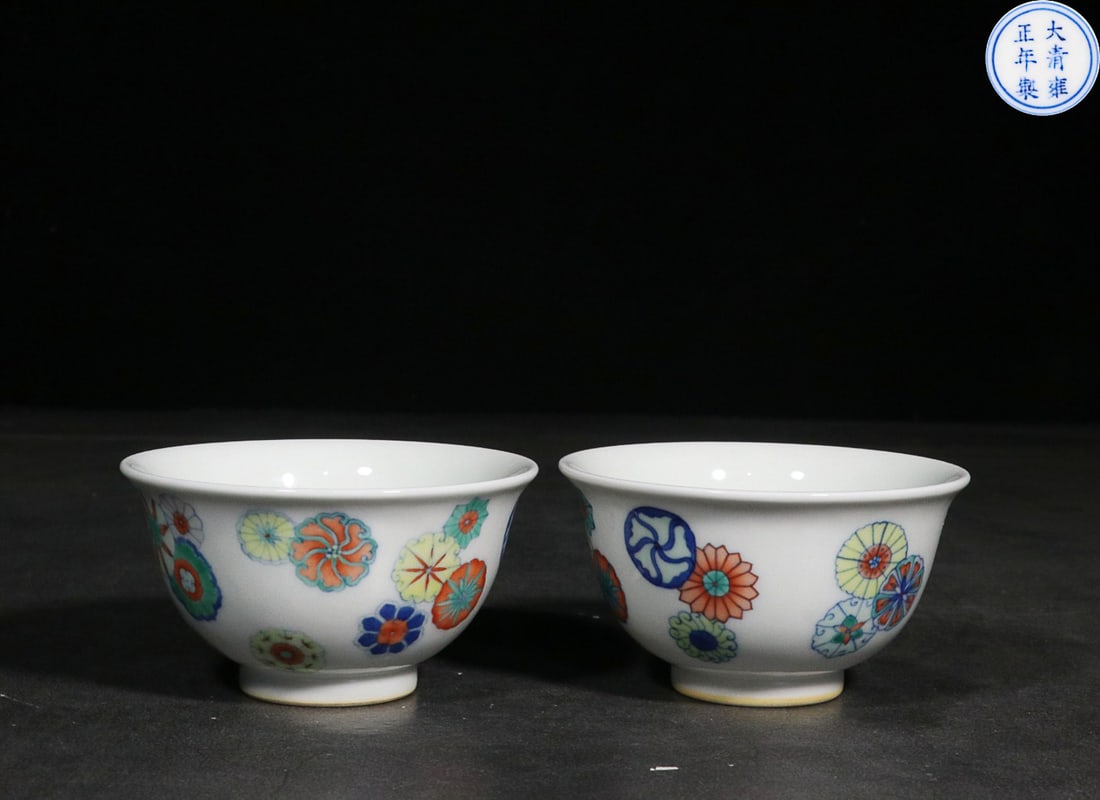 A PAIR OF FAMILLE-ROSE 'FLORAL' CUPS: Six-character reign mark of Qing Yongzheng Dimension: Height: 4.9cm, Mouth Diameter: 9cm, Base Diameter: 3.7cm Weight: 108.6 & 106.6g Property from an European private collection. Please contact the s