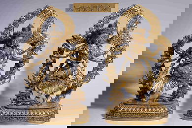 A PAIR OF GILT-BRONZE STATUES OF SIX-ARMED GUANYIN