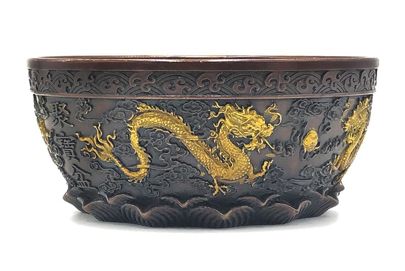 Chinese Bronze Bowl: Chinese bronze ware bowl with dragon and lotus base. Measurement: 4"H x 8.5"W x 8.5"D.