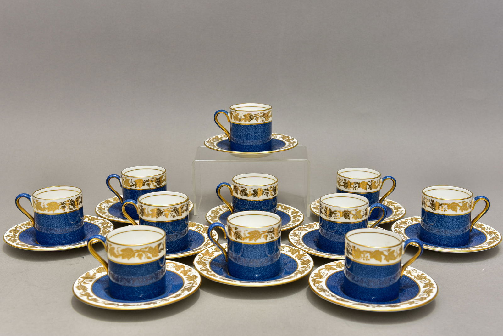 Set of 11 Wedgwood Whitehall Powder Blue Demitasse Cups and Saucers: Marked: Wedgwood Bone China / Made in England Dimensions: -Cup: 3 7/8” Diam. x 2 1/8” H -Saucer: 4 3/4” Diam.