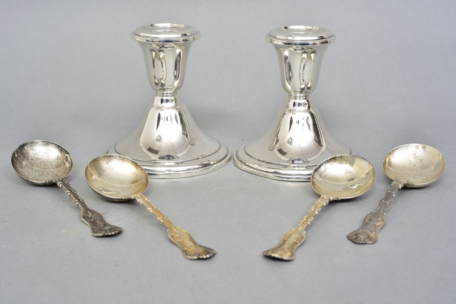 Pair of Newport Weighted Sterling Candlestick Holders and Set of 4 Sterling Silver Spoons (1 of 6)