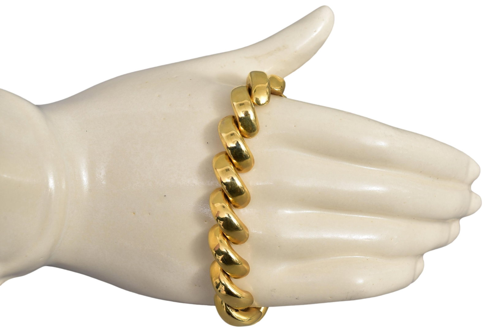14k Yellow Gold Twist Bracelet: Weight: 29.8 grams Dimensions: 7" long Marked: 14Kt / Hallmark Town Auction House & Gallery offers local delivery to Manhattan, Connecticut and Westchester for most items excluding large furniture. Fo