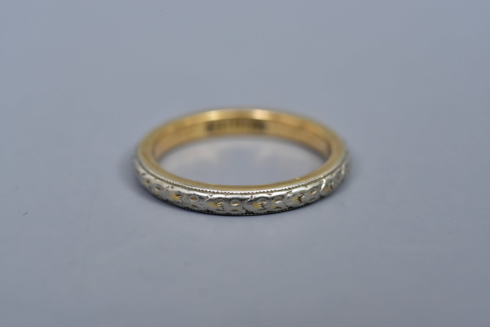 18k Gold Art Deco Two Tone Band: Size: 5 3/4 Weight: 3.8 grams Marked: HH / 18K Town Auction House & Gallery offers local delivery to Manhattan, Connecticut and Westchester for most items excluding large furniture. For a price quote 