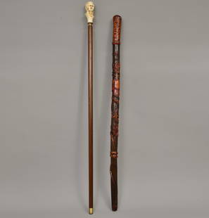 Antique Folk Art Walking Stick With Eagle and Wraparound Snake, Mozart Walking Stick: Carved walking stick depicting a carved eagle with snake in beak, wraparound lizard, Indian Chief and insects measuring 36" long. Resin Mozart stick measures 39&rdquo; long. Town Auction House & Galle