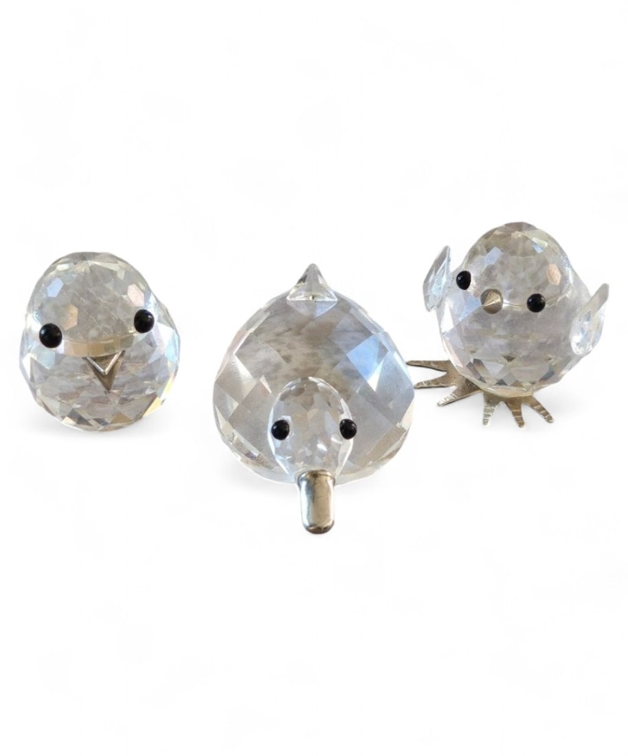 3 Miniature Swarovski Figurines: Set includes 3 miniature Swarovski figurines. One Duckling, One baby chicken, and baby bird.