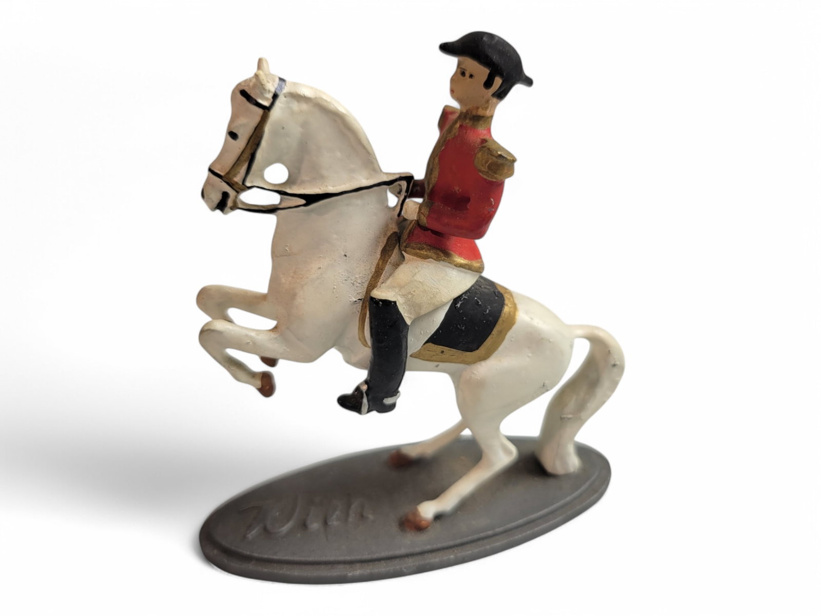 Wein Metal Toy Soldier Spanish Riding School Vienna: Wein Metal Toy Soldier Spanish Riding School Vienna. The rider on top is slight loose so it seems it is riding. Width 2.25" x Height 2"