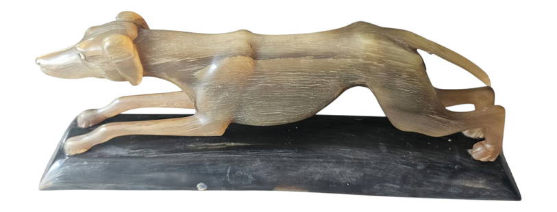 Greyhound Sculpture: Greyhound Sculpture made of Horn. Capture the beauty and energy of motion with this finely crafted sculpture. Wide 9" x 3.5"