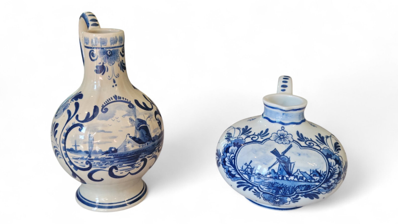 Delft Blue Jug & Pitcher: Delft Blue Jug & Pitcher. This set is in great condition. No nicks or chips. Left Pitcher is 6.25" H and Jug is 5" H x 3" W