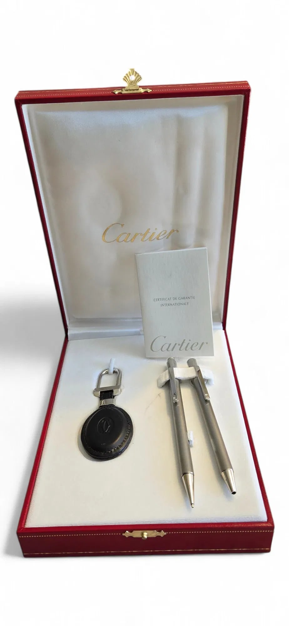 Must De Cartier Pen & Pencil Gift Set: Must de Cartier authentic Stainless Steel ballpoint pen, mechanical pencil and leather embossed keychain in original box make the perfect gift set for the busy executive. Pen and pencil have the Carti