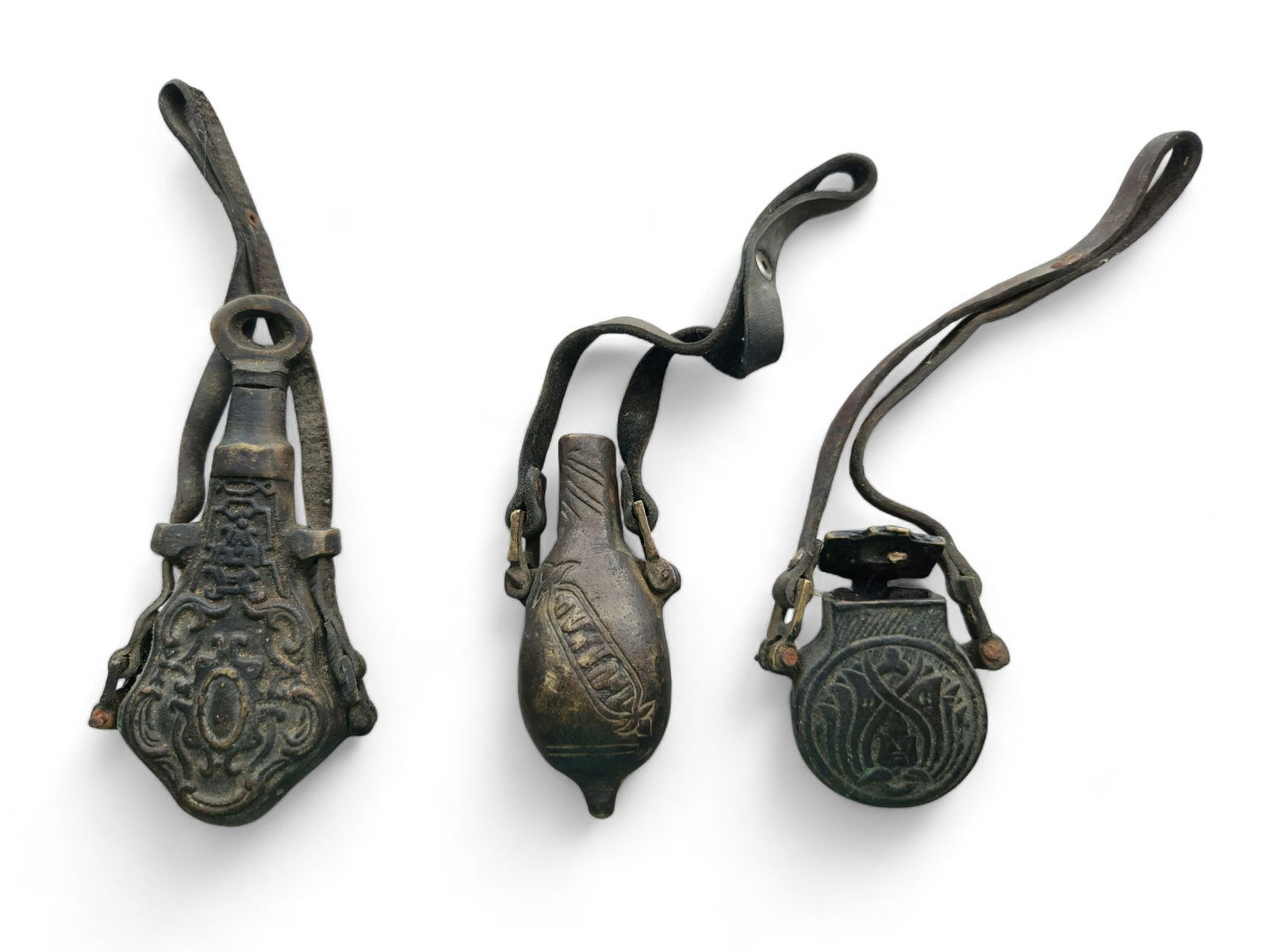 Group of 3 Turkish / Ottoman Empire Gunpowder Flask: Group of 3 Turkish / Ottoman Empire Gunpowder Flask. These still have the leather bands on them, the leather is hard. So it tells it's age. They measure about 3 - 4 inches in height