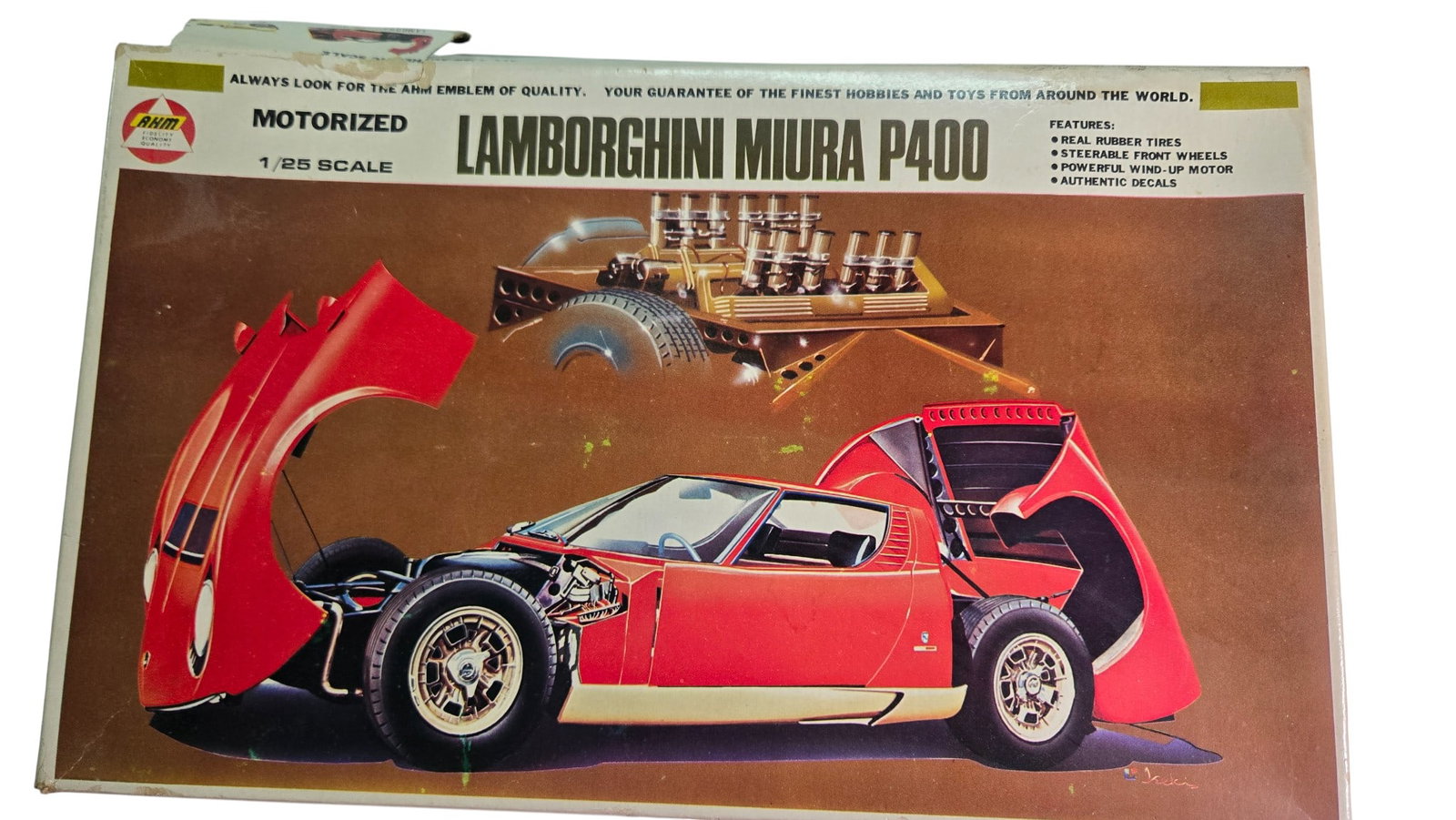 Motorized Model Kit - Lamborghini Miura P400 by AHM 1:25 scale: Motorized model kit - Lamborghini Miura P400 by AHM1:25 scale model. Opened box. Opened parts bag. Wind up motor included. Made in Japan. 1971
